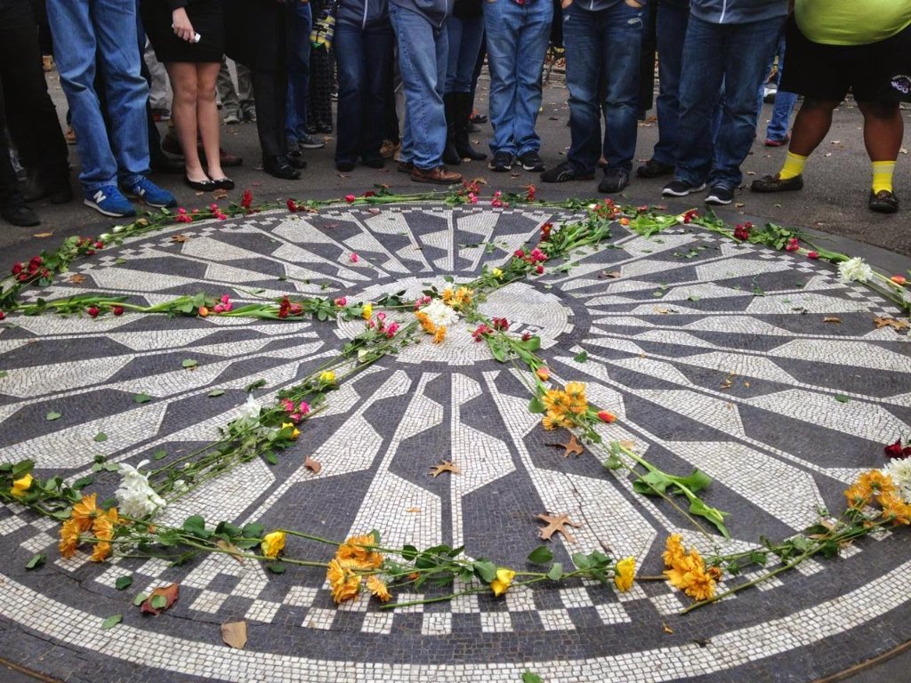 Strawberry Fields Imagine mosaic memorial in Central Park with flowers