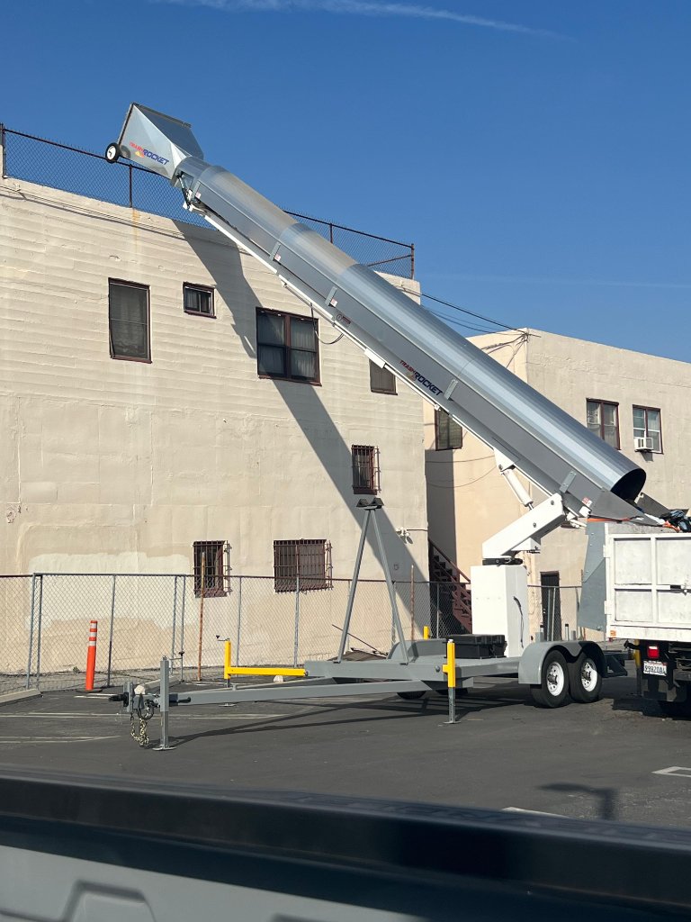 Orange trash chute with scaffolding