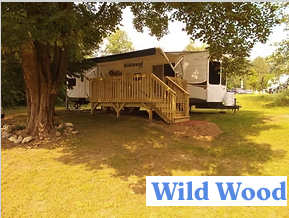 Wildwood exterior with deck in natural setting
