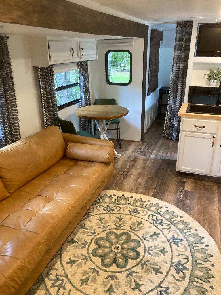Hideout living area with leather sofa and dining space