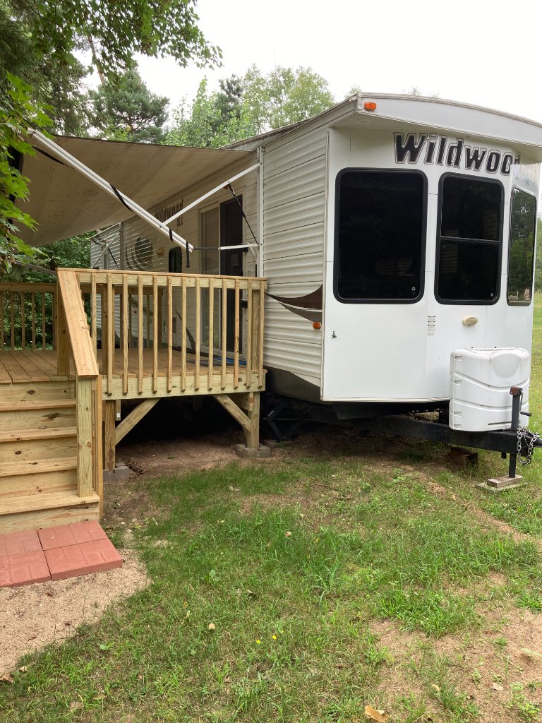 Wildwood exterior with deck and awning