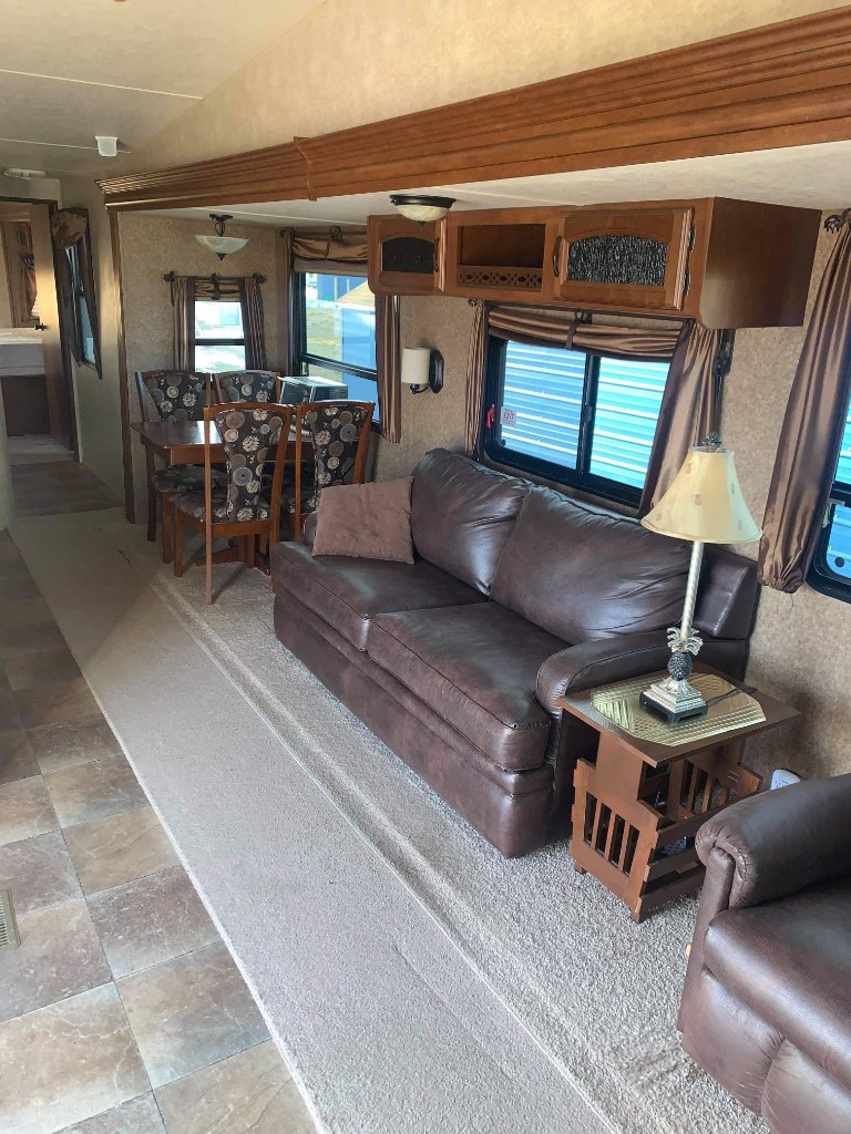 Wildwood spacious living area with leather sofas and dining table