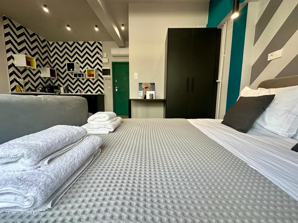Bedroom with teal-striped wall