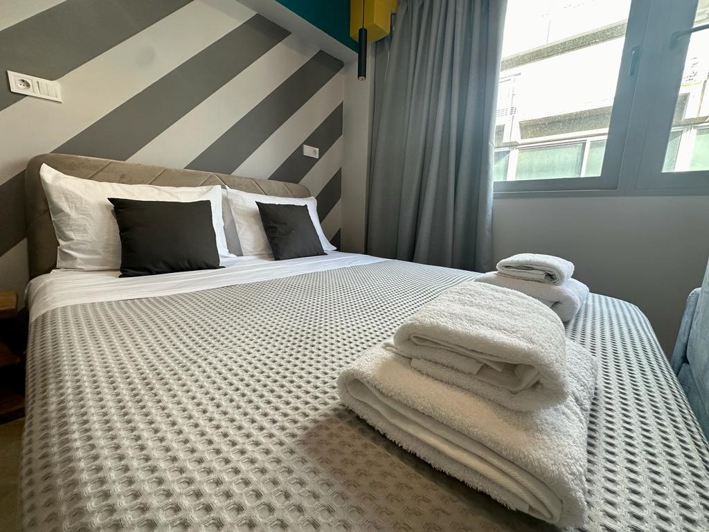 Bedroom with striped accent wall
