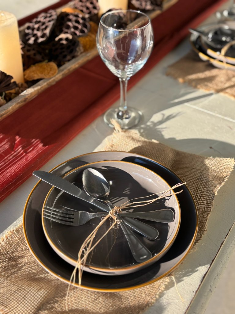 Warm fall tablescape with candlelight and natural textures