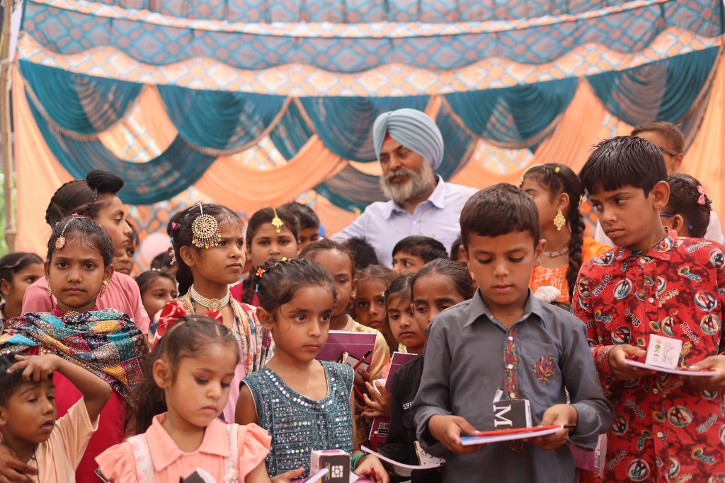 Children receiving educational materials