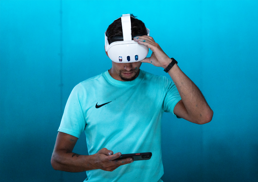 Artist using VR headset for mural design