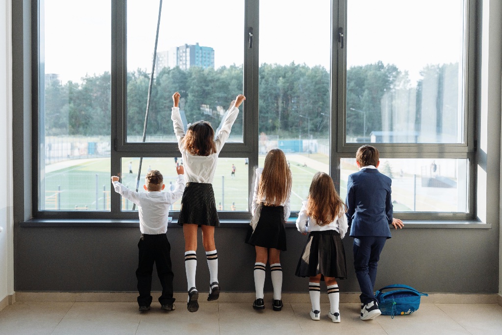 School children looking out a window