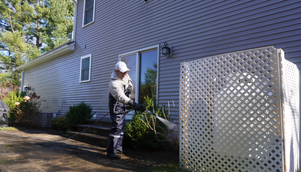 Deck and fence pressure washing service restoring wood surfaces in Massachusetts