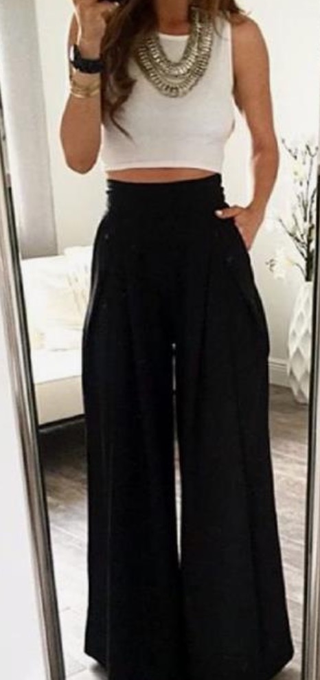 Female performer outfit example - white top with black wide pants
