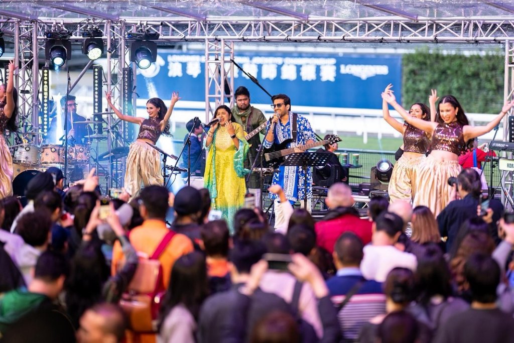 Energetic performance with live band and dancers entertaining the crowd