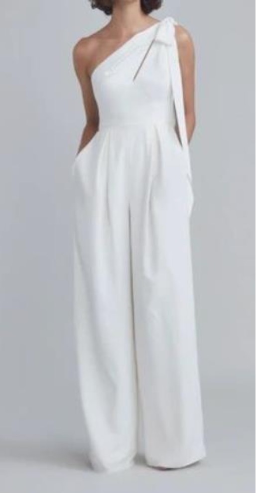 Female performer outfit example - white one-shoulder jumpsuit