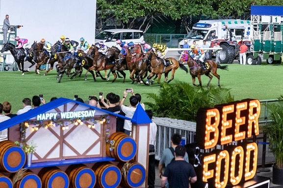 Exciting horse racing action with Happy Wednesday themed decorations