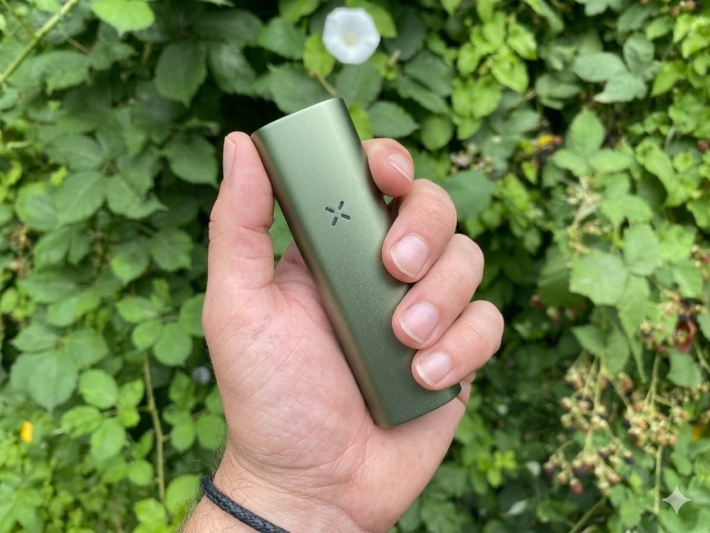 PAX Flow TED (Thermal Extraction Device) held in hand outdoors