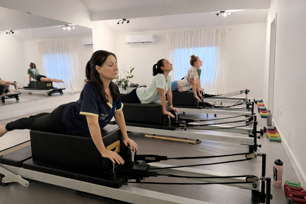 Pilates instructor guiding a client