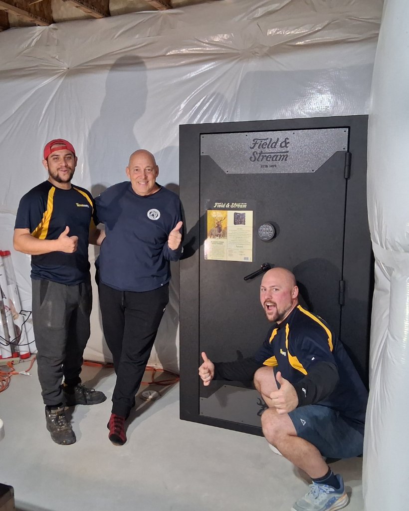 Professional gun safe movers using specialized equipment to transport heavy gun safe in Longmont, Colorado - Licensed, insured, background-checked safe moving team by MoveKings
