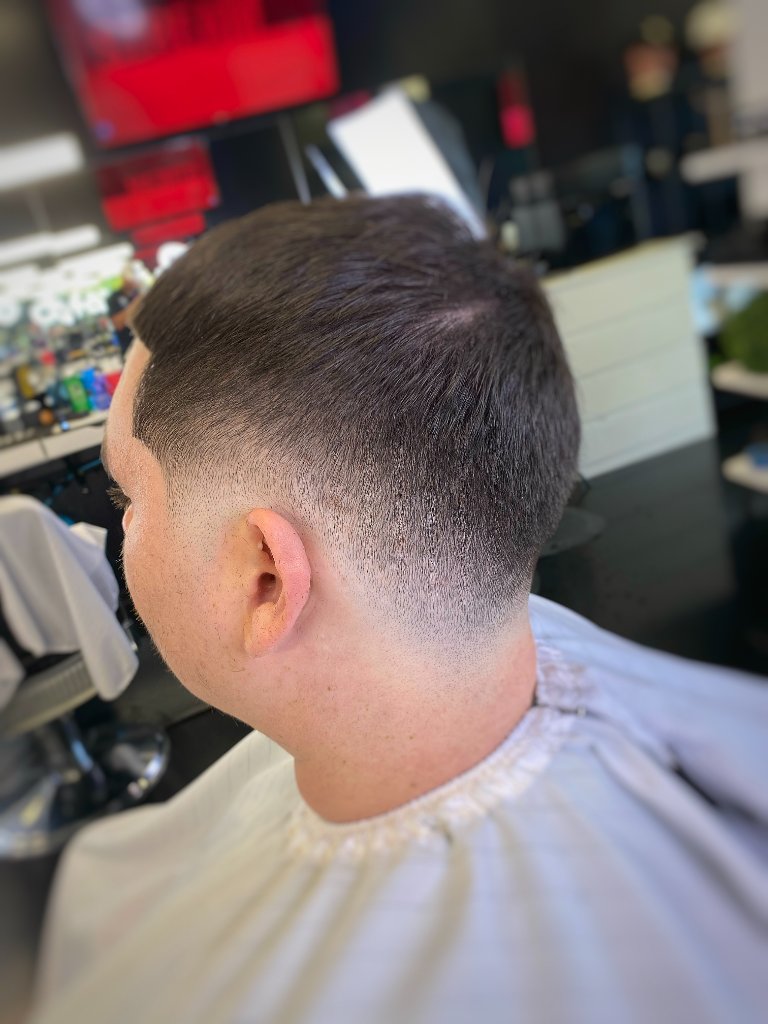 Clean taper fade back view at Galindo's Barbershop