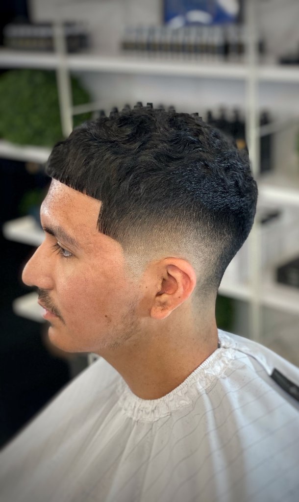 Wavy textured fade at Galindo's Barbershop Magnolia TX