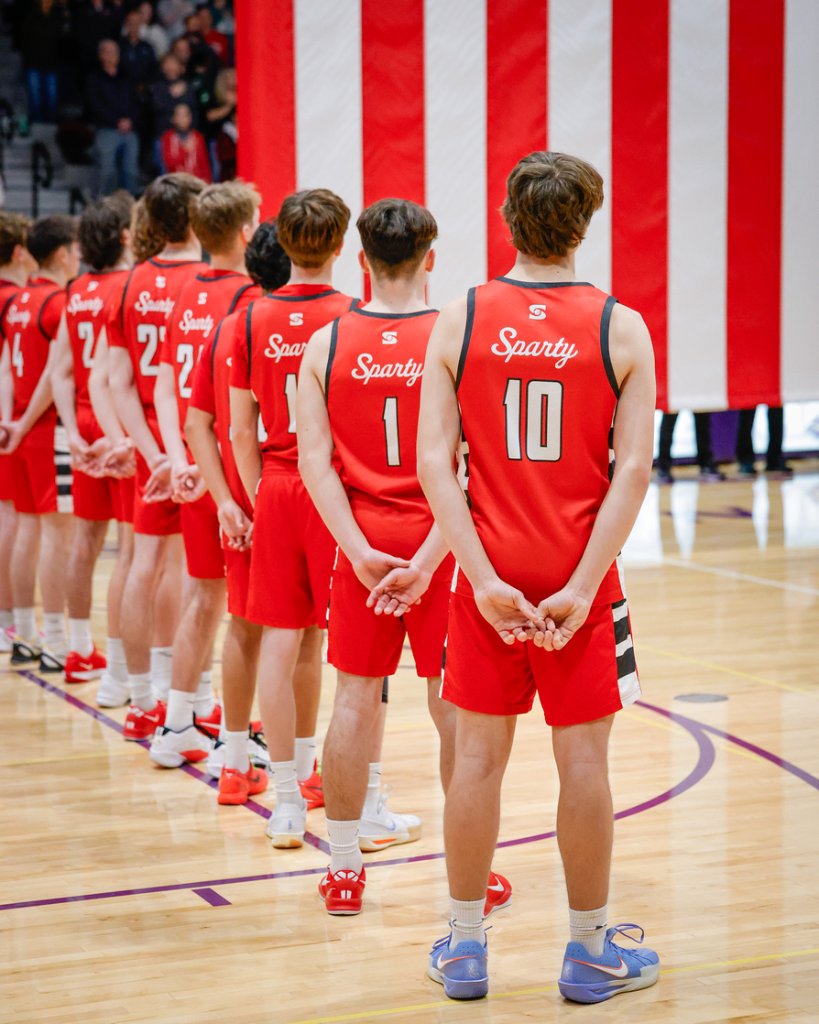 Team standing during national anthem