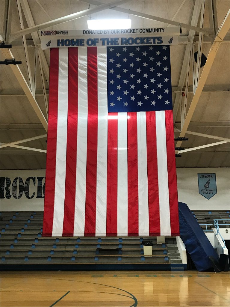 Flag installation in school gymnasium