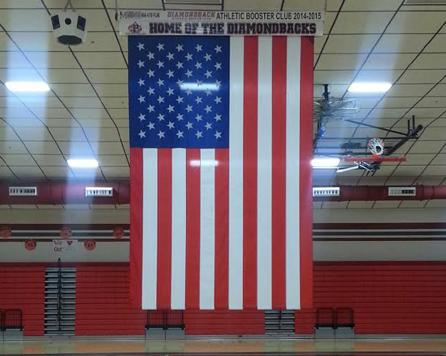 Flag installation in school gymnasium