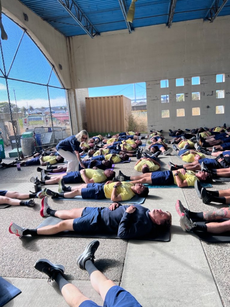 Lane Kennedy leading nervous system regulation breathwork session with San Francisco Fire Department
