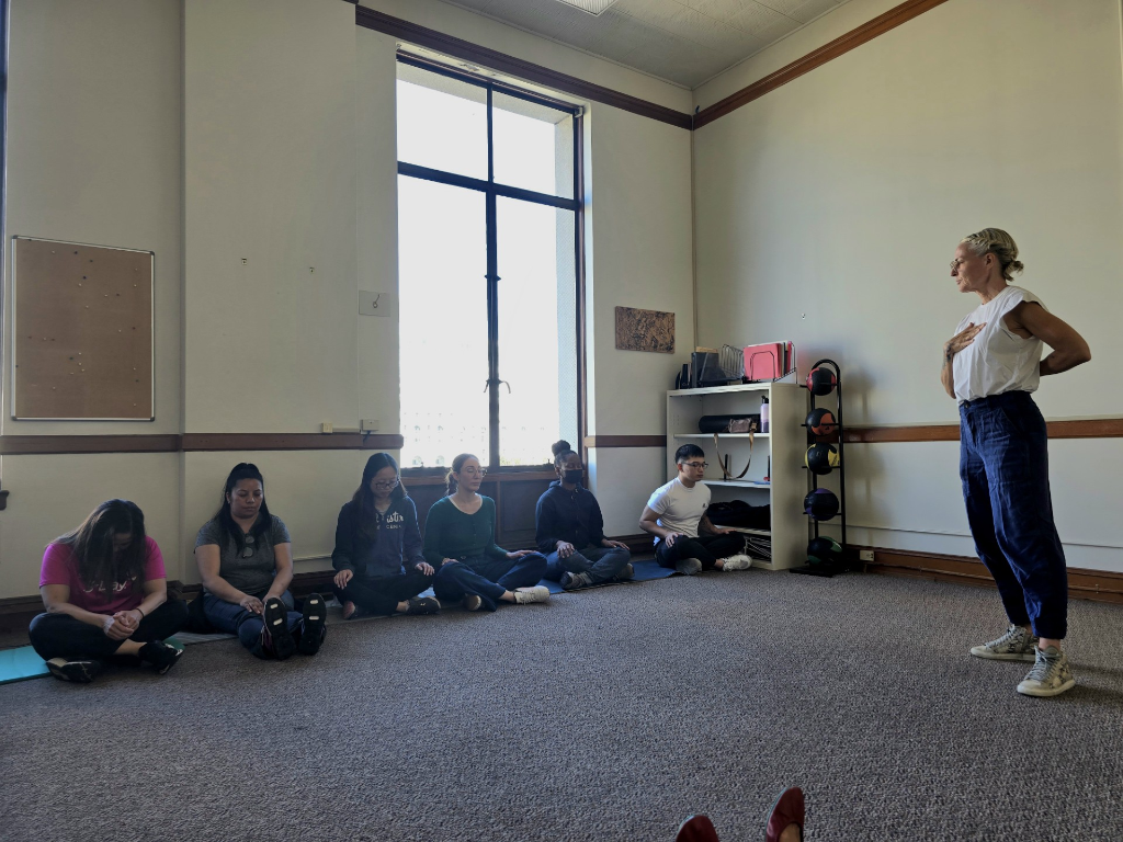 Lane Kennedy leading meditation at Public Health Laboratory