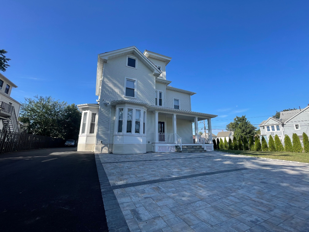 Beautiful property exterior with paver driveway - SYNC Properties Plainfield, NJ