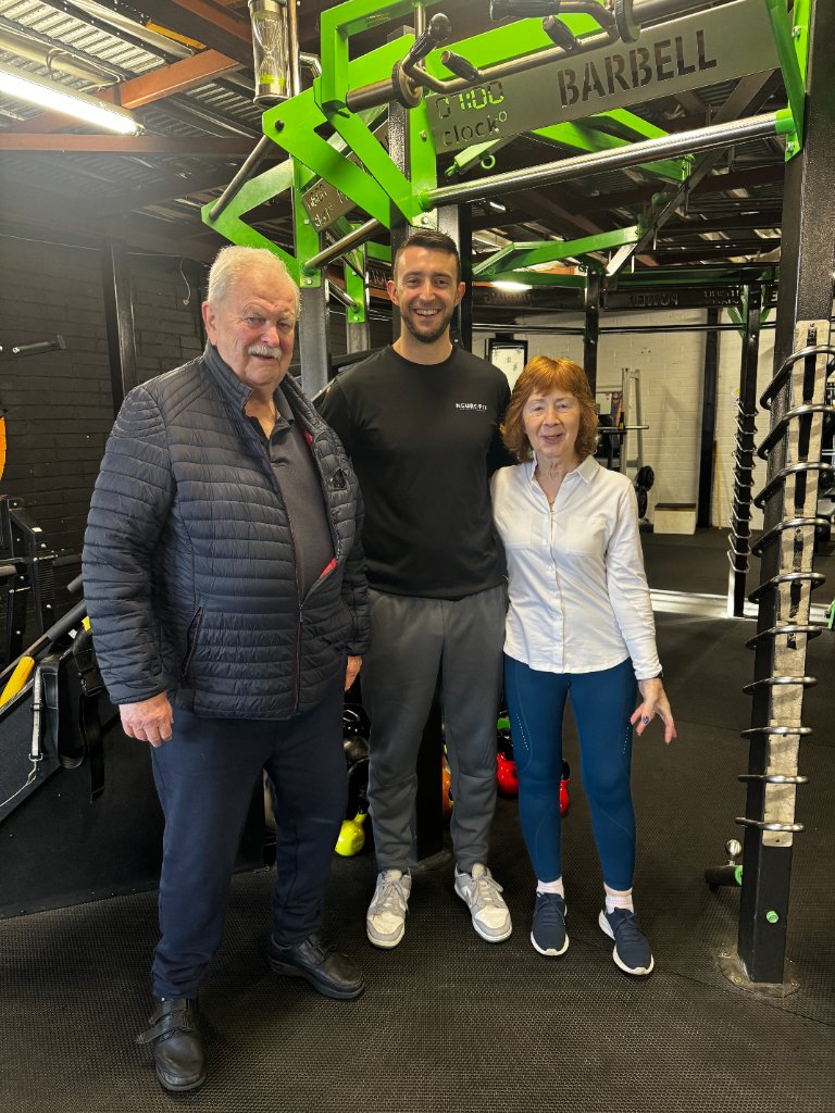 Brendan with clients at the gym