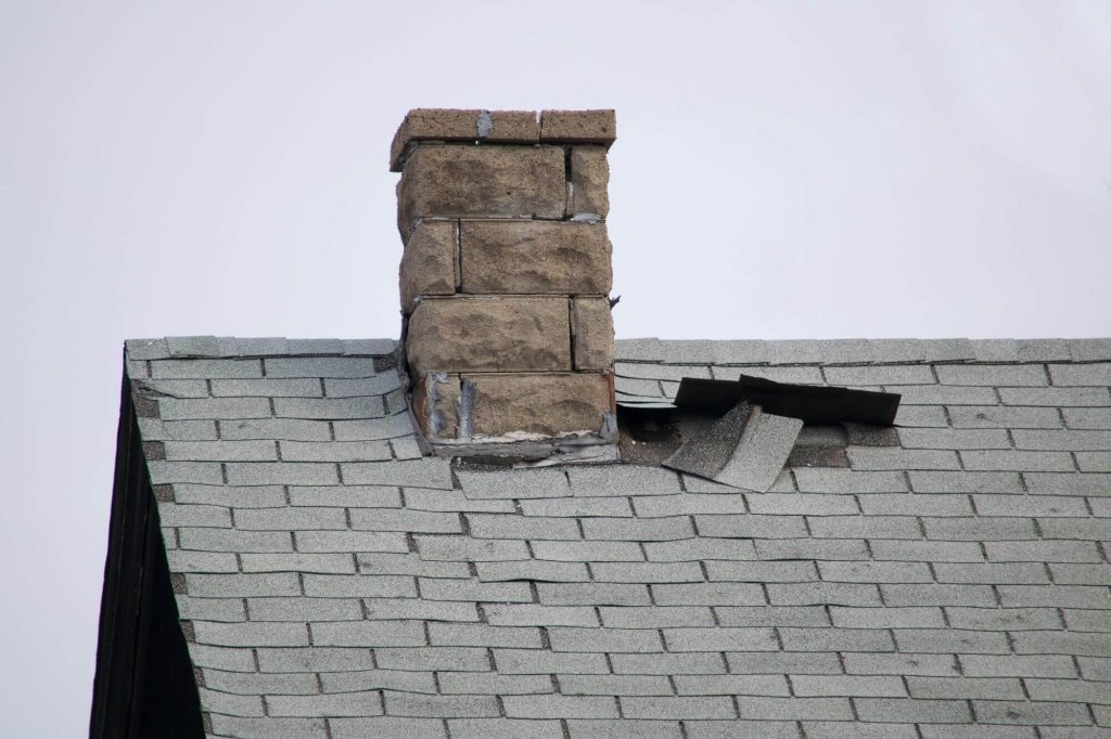 Roof damage around chimney area