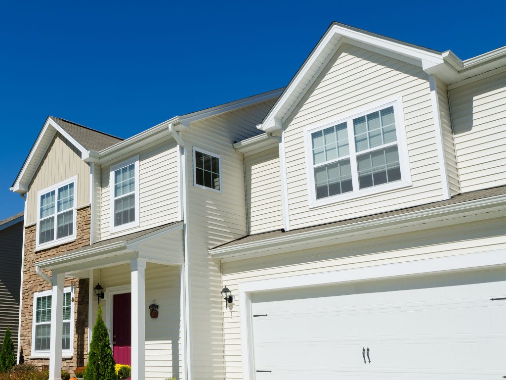 Beautiful modern home with premium white vinyl siding installation