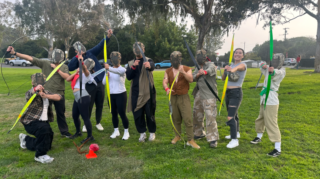 Archery tag team California - participants posing with foam arrow bows at mobile archery tag rental event