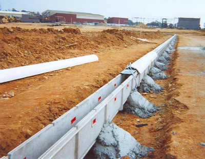 Commercial parking lot concrete curb and sidewalk installation