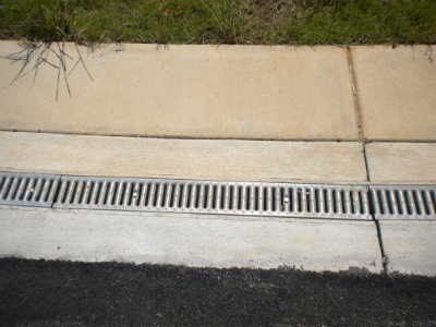 DRAW Enterprises completed track and field athletic complex with synthetic turf and trench drain system