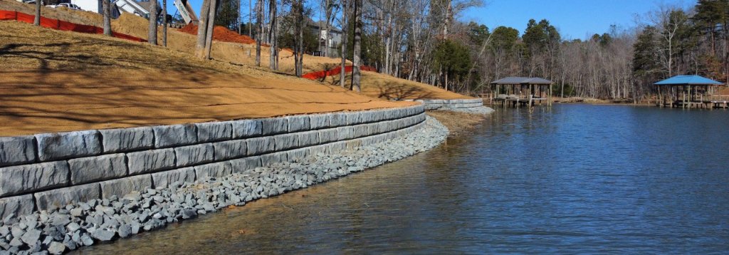 Shoreline view of completed residential retaining wall with erosion control