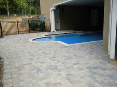 Paver walkway and garden path installation with landscape lighting at residence