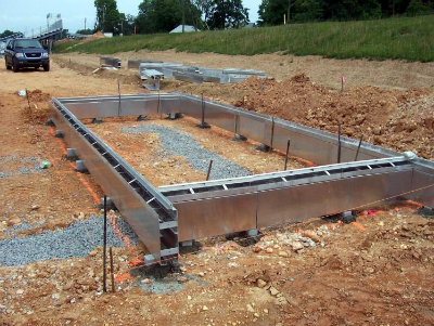 Athletic field sand pit installation with drainage infrastructure