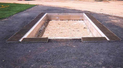 Long jump pit with trench drain surround at track facility