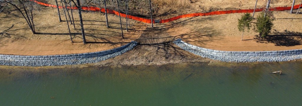 Aerial view of lakefront retaining wall construction by Draw Enterprises in the Carolinas