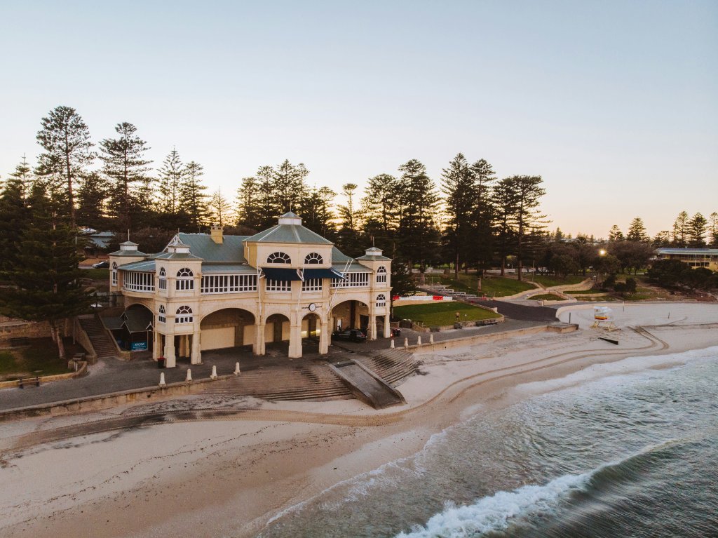 Historic Indiana Tea House on Cottesloe Beach Perth at sunset — iconic WA short-term rental destination requiring fire safety evacuation diagrams for Airbnb and Booking.com properties
