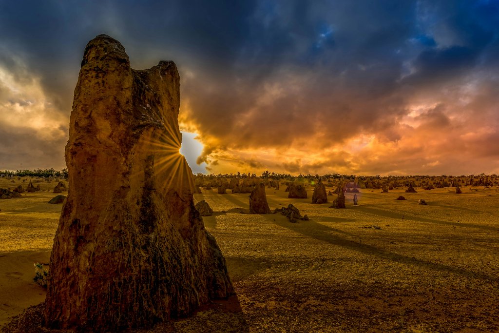 Pinnacles Desert limestone formations at sunset in Nambung National Park Western Australia — unique WA outback Airbnb location requiring AS 3745 fire safety compliance