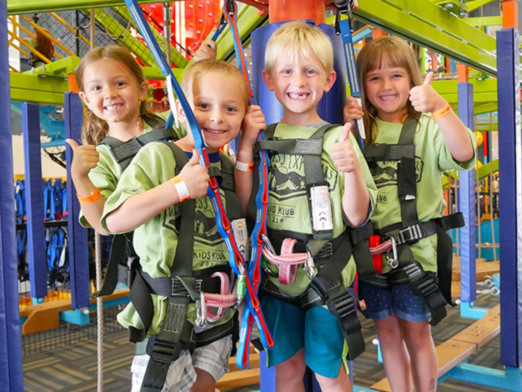 School field trip students exploring Sky Tykes ropes course at Allegan Event Michigan