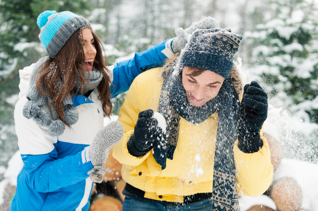 Couple having snowball fight