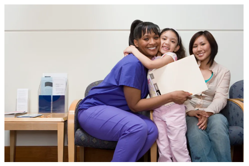 Nurse caring for child with family