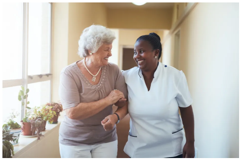 Nurse assisting elderly patient