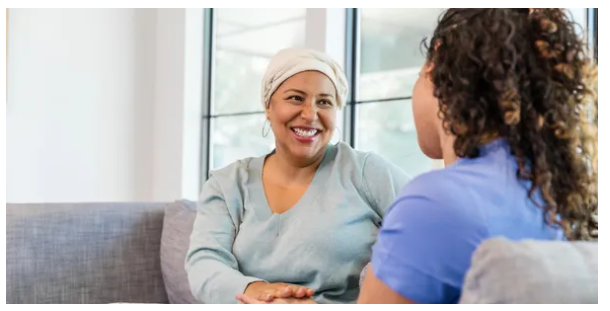 Caregiver smiling with patient