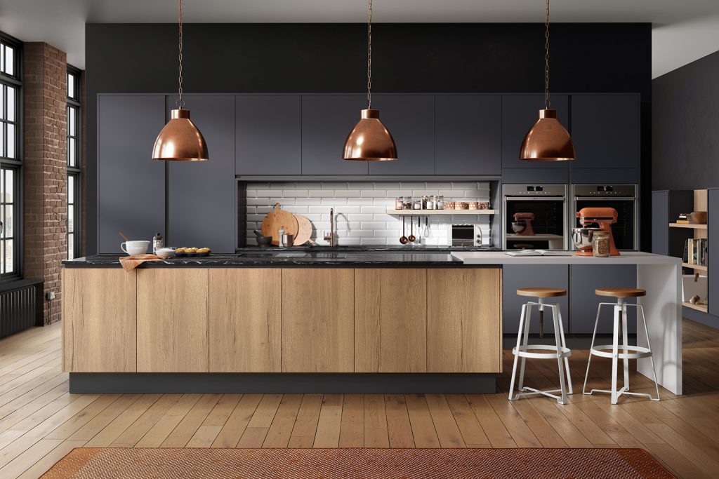 Modern kitchen renovation featuring dark blue cabinetry and New England oak woodgrain finishes