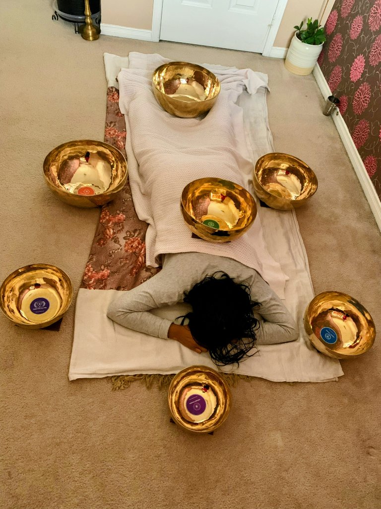Sound bath meditation setup with singing bowls