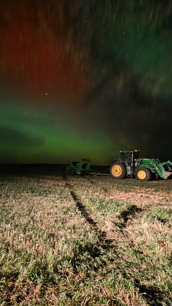 Tractor under northern lights