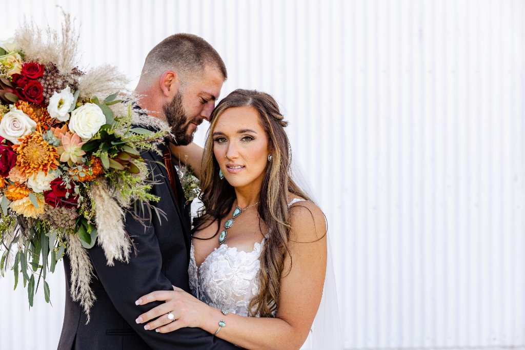 White Barn Couple Portrait